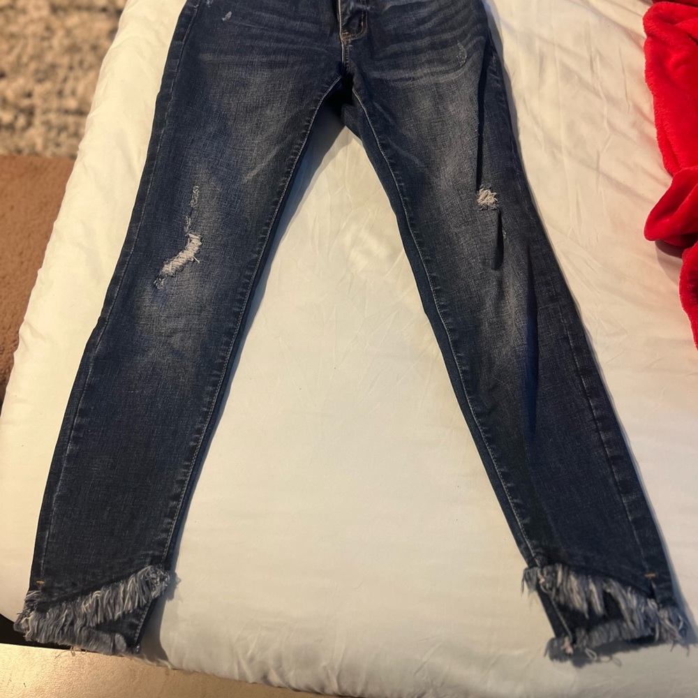 KanCan jeans with frayed bottoms
